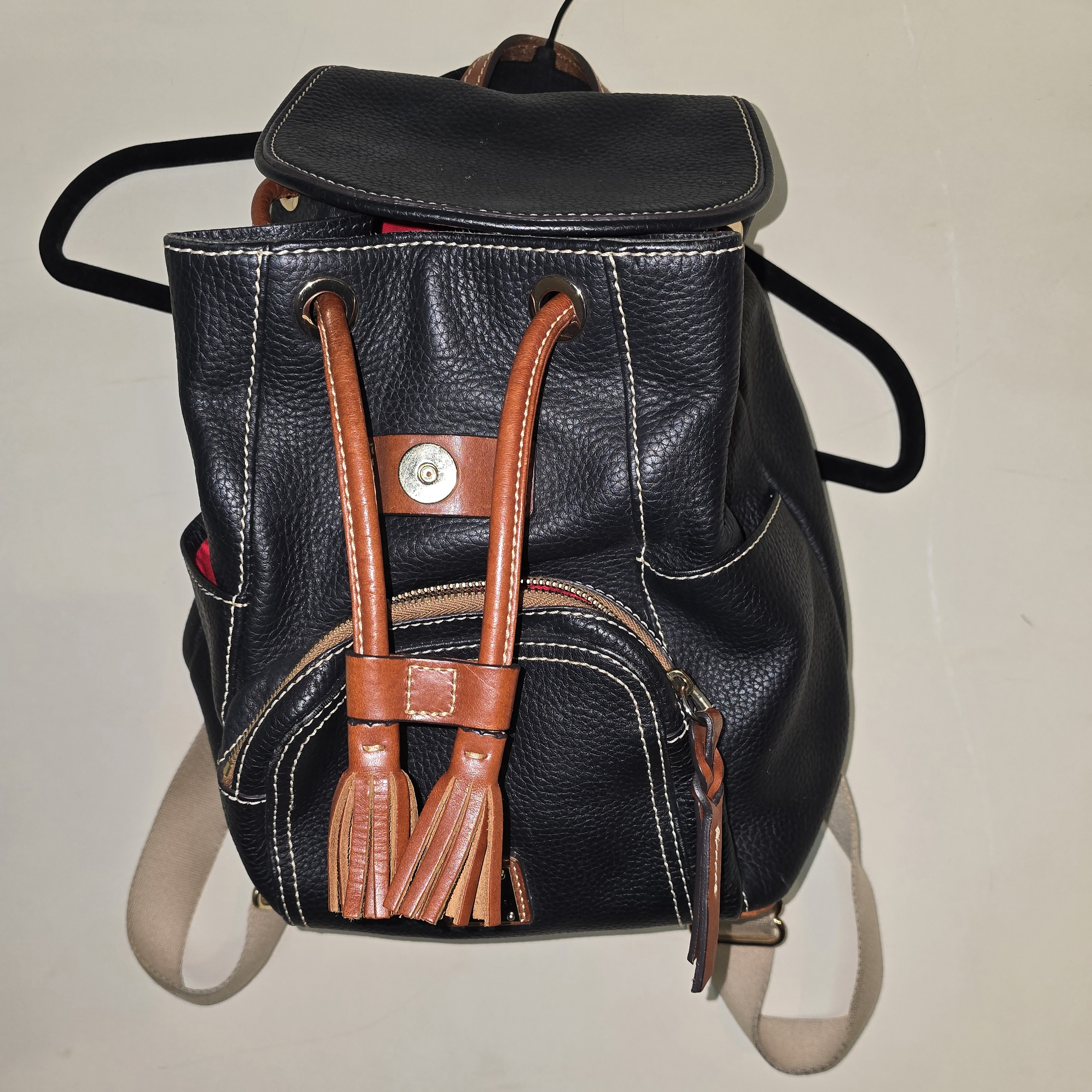 Dooney & Burke Black Leather Drawstring Backpack With Brown Tassels